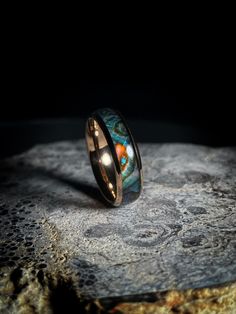 a ring that has been made to look like an image of the earth on it