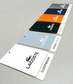 four credit cards with the name laccote on them are lined up in a row