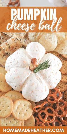 pumpkin cheese ball on a platter with crackers and pretzels