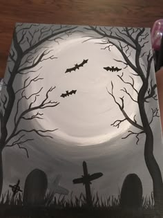 a painting of bats flying over a graveyard