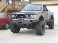 a gray truck parked in front of a house