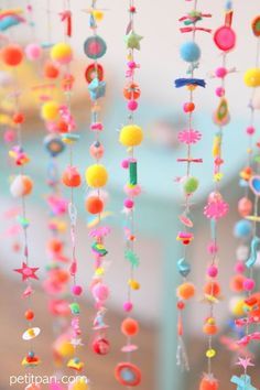 colorful beads hanging from the ceiling in a room