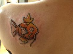 a woman with a fish tattoo on her back