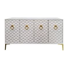 a white and gold sideboard with three brass handles