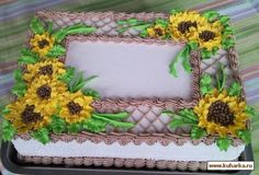 a decorated cake with sunflowers on it