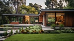 a modern house in the middle of a lush green yard