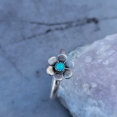 Embrace your inner flower child with this Floral Ring featuring a beautiful American Mined turquoise from Arizona in the center, perfect for everyday wear. Made of sterling silver, this customizable ring is sure to match your unique style. A must-have accessory for nature lovers, festival goers, and those who love all things 60s and 70s. * 925 sterling silver * American Mined Turquoise* Handmade in our studio in WA state. This piece will be made to order according to your ring size, and will shi Bling Things, Wa State, Turquoise Flowers, Floral Ring, Flower Child, Flower Ring, Nature Lovers, Turquoise Jewelry, Ring Necklace