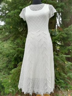 Handknitted lacedress, natural white. Based on Haapsalu lace stitch- patterns. Estonian lace.  Yarn: 100% merinowool Size: XS/S (EU) 34 - 36 (EU)  Every handknitted dress is unique.  You can be most certain, that no-one else has similar dress, as You.  There are 12 beads on the back of the dress.   Care: Hand wash in mild, lukewarm water detergent for delicate garments. Rinse. Gently squeeze out water, do not twist. Lay flat, stretch and fix with pins from the edges, let it dry. No ironing! Than Elegant Crochet Wedding Dress, Elegant Crochet Dress For Wedding, Fitted White Crochet Dress With Lace Sleeves, White Fitted Crochet Dress With Lace Sleeves, Elegant Fitted Crochet Dress With Pointelle Knit, Elegant Crochet Dress With Scalloped Lace For Wedding, Elegant Crochet Dress With Lace Work, Elegant Crochet Dress With Delicate Lace, Elegant Crochet Dress With Pointelle Knit