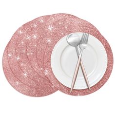 pink glitter dinner plates with silverware on them