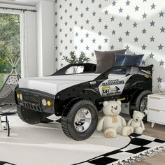 a black and white truck bed in a room with stars on the wall behind it