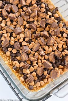 chocolate and peanut butter squares in a glass baking dish