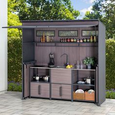 the outdoor kitchen is built into the side of a building with shelves and cupboards