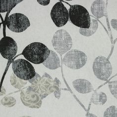 a close up view of a wallpaper with black and white leaves