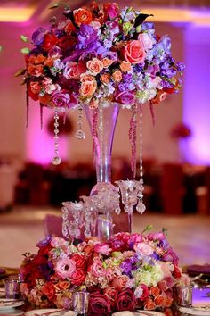 the centerpieces are adorned with crystal vases and flowers