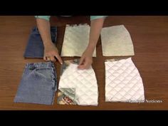 someone is making quilts out of jeans on the floor with their hands and fingers