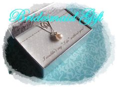 the bridesmaid necklace is in its gift box