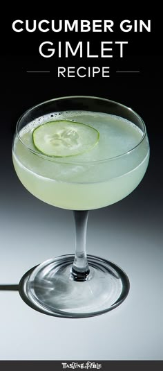 a cucumber sitting on top of a glass filled with liquid