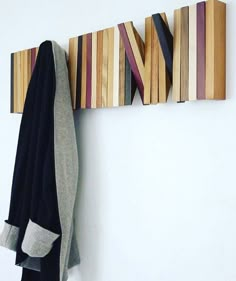 the coat rack is made out of wood strips