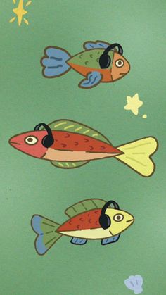 three fish with headphones are swimming in the water