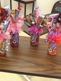 candy bar bouquets are arranged on a table