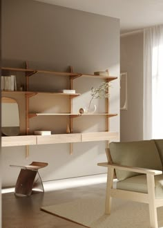 a living room filled with furniture next to a wall mounted book shelf and window sill