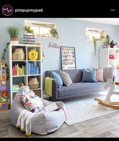 a living room filled with furniture and lots of bookshelves on top of it