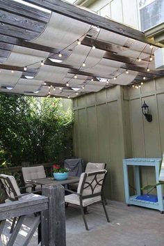 an outdoor patio with lights strung over it