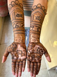 two hands with hendi designs on them, one is showing the number three and the other