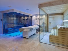 a large spa room with a glass walled shower