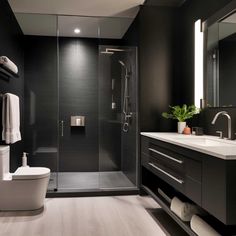 a modern bathroom with black walls and white fixtures