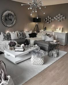 a living room filled with lots of furniture and decor