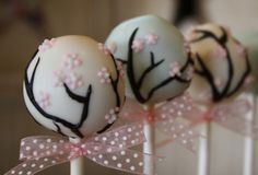 cake pops decorated with white and pink frosting