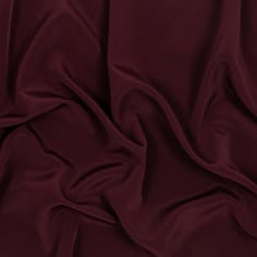 an image of a plain maroon fabric