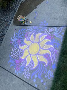 a child's drawing on the sidewalk with chalk