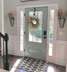 an entryway with a welcome sign above the door