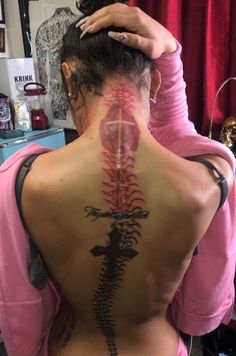 a woman with a tattoo on her back