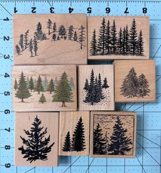 four rubber stamps with trees on them