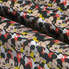 the mickey mouse pattern is shown on this black and white background with red, yellow, and gray colors