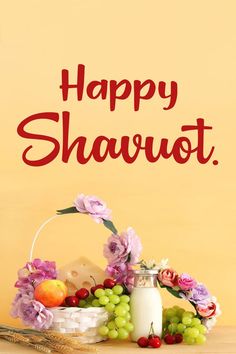 a happy shavut greeting card with flowers, grapes and milk on a table