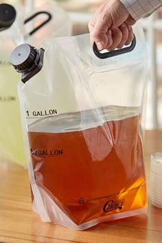 a person is pouring liquid into a bag