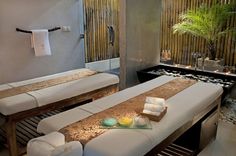 there is a spa room with two massage beds