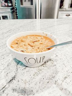 a bowl of soup sitting on top of a counter