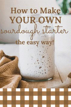 a jar filled with white liquid sitting on top of a table next to a brown and white checkered towel