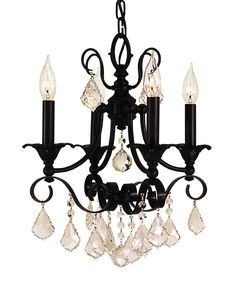 a black chandelier with crystal drops hanging from it