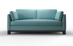 a blue couch sitting on top of a white floor