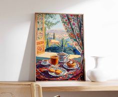 a painting hanging on the wall next to a table with food and drink in it