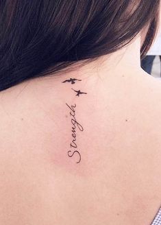 the back of a woman's neck with an airplane and stars tattoo on it