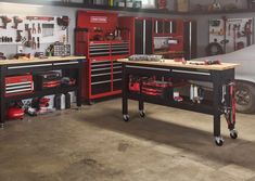 two workbenches with tools on them in a garage