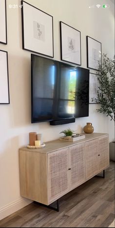 a flat screen tv mounted to the side of a wall