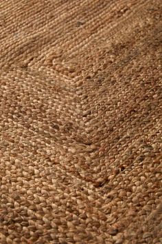 an area rug with brown woven material on it